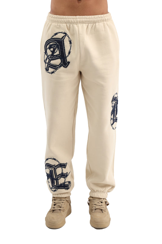 Applique sweatpants with embroidered patchwork